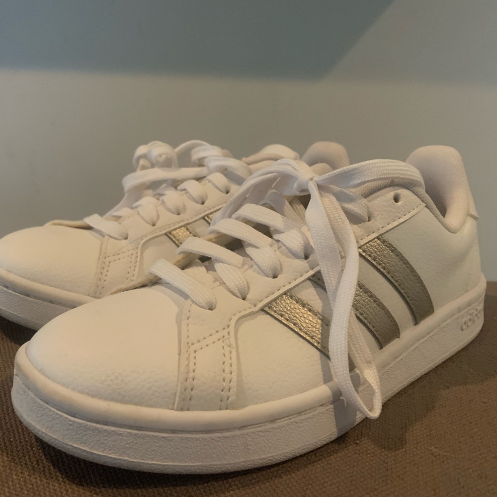 Adidas sneakers white with silver. Never worn. Great condition.